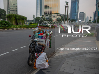 A street vendor at a business area in Jakarta on May 11, 2021. The Asian Development Bank (ADB) has projected the Indonesian economy to grow...