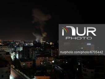 Smoke billows from Israeli air strikes in Gaza City, controlled by the Palestinian Hamas movement, on May 12, 2021. (