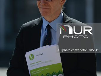 Frank Feighan, Minister of State for Public Health, Well Being and National Drugs Strategy, seen with a copy of the Healthy Ireland strategi...