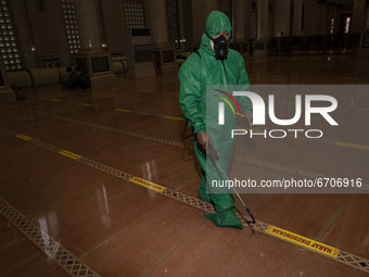 Desinfectan spraying at Gold Mosque in Depok, West Java, Indonesia on May 12, 2021 ahead Eid Fitr preparation. Muslim in Indonesia can pray...