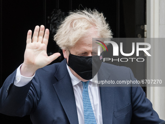 LONDON, UNITED KINGDOM - MAY 12, 2021: British Prime Minister Boris Johnson leaves 10 Downing Street for the House of Commons to give MPs an...