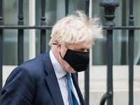 LONDON, UNITED KINGDOM - MAY 12, 2021: British Prime Minister Boris Johnson leaves 10 Downing Street for the House of Commons to give MPs an...