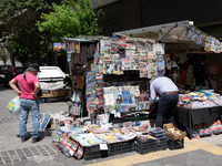 People are looking at the newspapers at a kiosk at the center of Athens, Greece on May 15, 2021. (