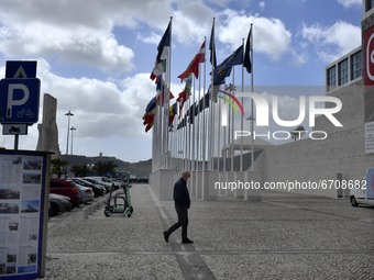 A man walks near the flag square of the Portuguese presidency of the European Parliament, in Belem, Lisbon. 15 May 2021. The European Parlia...