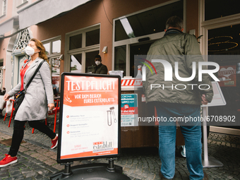 test required is seen in front of a outdoor cafe in Lippstadt,  Germany on May 12, 2021 as Soest and Lippstadt are two the first model citie...