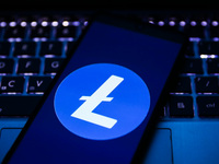 Litecoin cryptocurrency logo is displayed on a mobile phone screen photographed for illustration photo. Krakow, Poland on May 12, 2021.  (