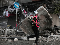 Safety officials inspect damaged buildings in Gaza City following an Israeli airstrike on May 12, 2021, in Gaza Strip(
