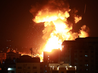 Fire billows from Israeli air strikes in the Gaza Strip, controlled by the Palestinian Islamist movement Hamas, on May 13, 2021.  (