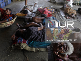 Labor of Kawran bazar area sleep in daytime in their workplace, in Dhaka, Bangladesh, on March 29, 2014. Foods are coming from long distance...