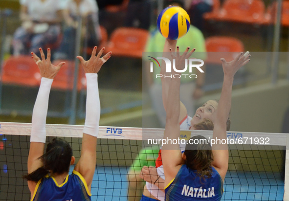 Tijana Malesevic (Top) of Serbia spikes the ball during the FIVB World Grand Prix intercontinental round match against Brazil at Indoor Stad...