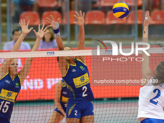 Monique Marinho Pavao (#15) and Juciely Cristina Barreto (#2) of Brazil attemp to block the ball from Marta Drpa (#2) of Serbia during their...