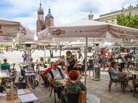 Restaurant gardens at the Main Square are reopened after the lockdown due to the coronavirus pandemic in Krakow, Poland on May 15, 2021. Fro...