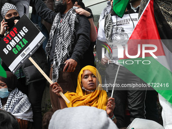 Free Palestine protestors clash with police outside the Israeli Embassy on Kensington High Street, an estimated 150,000 people attended the...
