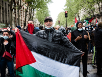 A man holds a Palestinian flag on May 15, 2021 when, at the call of many organizations, a demonstration in support of the Palestinian people...