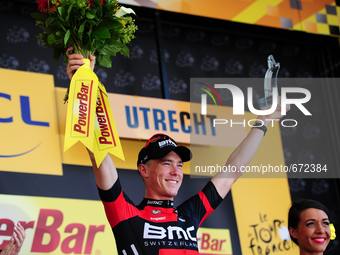 BMC Racing Team rider Rohan Dennis of Australia raises the trophy after winning Stage 1 of the Tour de France in Utrecht, Holland on July 4,...