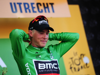 BMC Racing Team rider Rohan Dennis of Australia puts on the green jersey after winning Stage 1 of the Tour de France in Utrecht, Holland on...