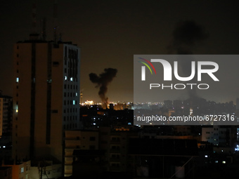 Smoke billows above buildings after an Israeli airstrike on Gaza City in the Gaza Strip early on May 17, 2021. 
 (