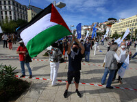 A protester carrying a Palestinian flag shouts slogans against Israel during a rally in Lisbon. May 17, 2021. The Portuguese Council for Pea...