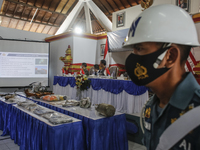 Indonesian Navy officer shows the part of sunken Indonesian Navy submarine KRI Nanggala 402 during press conference at Indonesia Navy Base i...