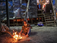 A Worker burn paper offerings before Cantonese Opera show, in Cheung Chau in Hong Kong, Monday, May 17, 2021. Cheung Chau Bun Festival or Ch...