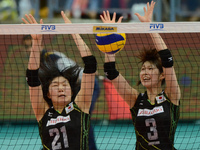 Saori Kimura (R) and Riho Otake of Japan attemp to block the ball during the FIVB World Grand Prix intercontinental round match against Serb...