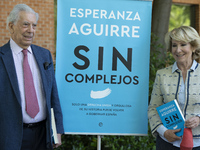 the former president of the Community of Madrid Esperanza Aguirre , accompanied by the writer Mario Vargas Llosa, attends the presentation o...
