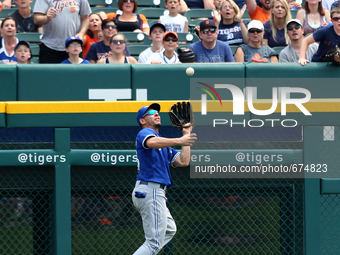 Toronto Blue Jays' Danny Valencia catches the ball hit by Detroit Tigers' Alex Avila during the second inning of a baseball game against the...