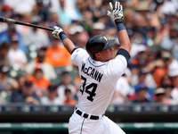 Detroit Tigers' James McCann hits a single in the second inning of a baseball game against the Toronto Blue Jays in Detroit, Michigan USA, o...