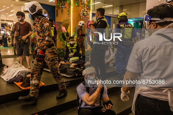 An injured passenger is seen at KLCC station after an accident involving Kuala Lumpur Light Rail Transit (LRT) trains in Kuala Lumpur on May...