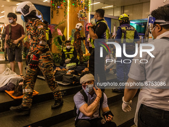 An injured passenger is seen at KLCC station after an accident involving Kuala Lumpur Light Rail Transit (LRT) trains in Kuala Lumpur on May...