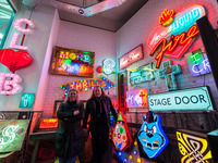LONDON, UNITED KINGDOM - MAY 25, 2021: Neon makers and designers Linda and Marcus Bracey (L-R) of Gods Own Junkyard pose next to an installa...