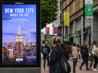A street billboard with the words 'New York City Misses You Too' seen in the center of Dublin.
The next stage of defrosting the Irish econom...