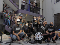 Members of the Mexican group Orquesta Basura (Garbage Orchestra), perform with their followers in the neighborhood Plaza 2 de Abril, located...