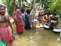 Villagers gathered to collect drinking water from the only left tube well. All other handpumps are completely under water right now.  On May...