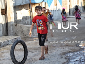 Daily life of displaced Syrians in Karama camps in the northern countryside of Idlib governorate on the Syrian-Turkish border on May 30, 202...