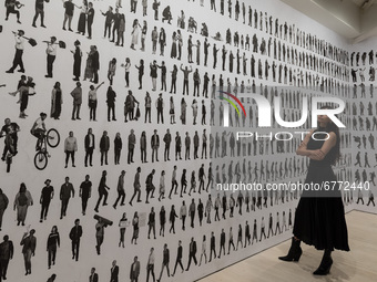 LONDON, UNITED KINGDOM - JUNE 02, 20201: A woman looks at 'The Chronicles of New York City' (2019) by JR (French, born 1983) during a press...