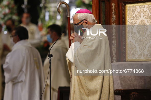 The archbishop Francisco Javier Martinez prays wearing a face mask during the traditional Mass of the Corpus Christi in the Cathedral on Jun...