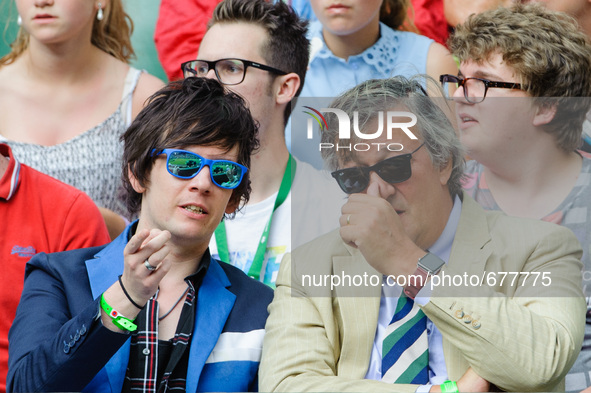 Stephen Fry and husband Elliot Spencer seen watching tennis on the centre court