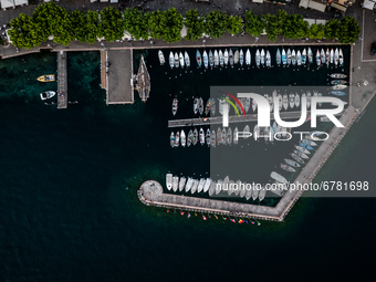 A drone view of boats moored at the harbour, in Garda, Italy, on June 5, 2021.  Lake Garda is the largest lake in Italy and a popular holida...