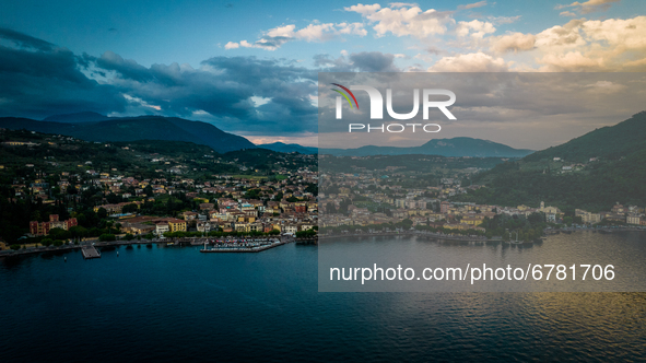 A drone view of Garda, Italy, on June 5, 2021, during the sunset.  Lake Garda is the largest lake in Italy and a popular holiday location in...