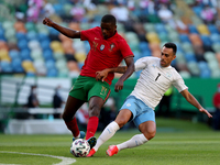 William Carvalho of Portugal (L) vies with Eran Zahavi of Israel during the international friendly football match between Portugal and Israe...