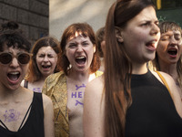 Belarusian pro democratic activist screams during Minute of Scream For Belarus action in Warsaw on June 10, 2021. (