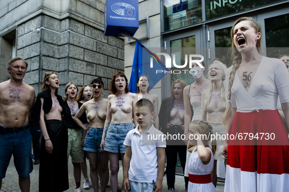 (EDITOR'S NOTE: This image contains nudity.) Belarusians and pro-Belarusian activists gathered in front of Warsaw's European Commission offi...