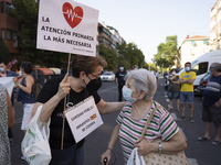 Several dozen people participate in a demonstration in defense of the maintenance of the Abrantes Health Center, in the district of Carabanc...