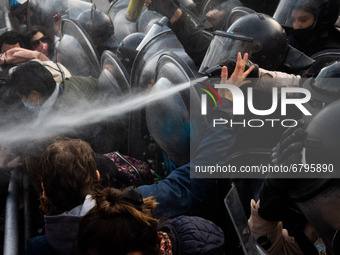 Demonstrators clash with riot police during a protest held by people who were fired during the covid-19 pandemic in Buenos Aires, Argentina,...