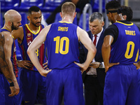 Coach of FC Barcelona Sarunas Jasikevicius talking with his players during the Liga ACB playoff 3rd match of the semi final between FC Barce...