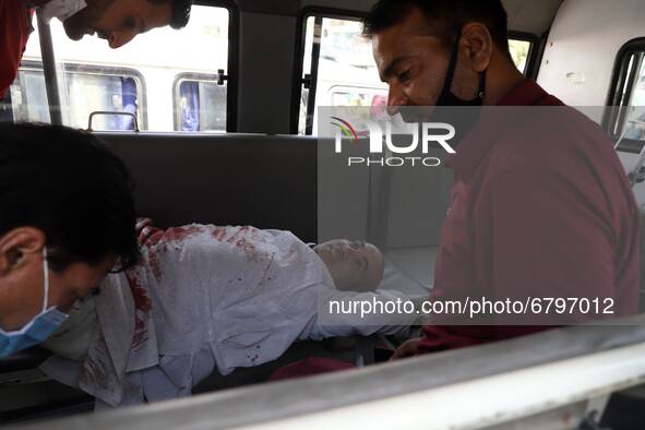 Injured being taken to SDH Sopore after Militants attacked Police party in Sopore, Jammu and Kashmir, On 12 June 2021. Many killed and many...