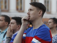 Russian supporters react on Christian Eriksen of Denmark (not seen) injury while watching a live stream during the UEFA Euro 2020 Championsh...