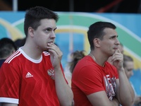 Russian supporters react on Christian Eriksen of Denmark (not seen) injury while watching a live stream during the UEFA Euro 2020 Championsh...