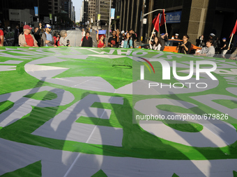 Protesters blocked traffic around the Fairmont Royal York Hotel ahead of the Pan Am Economic and Climate Summits in Toronto on 8th July 2015...